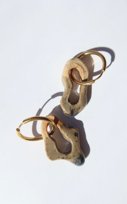 Mosca handmade ceramic earrings in Beige — organic sculpted clay with glossy glaze, made in Lisbon Portugal by Jadeo Studio