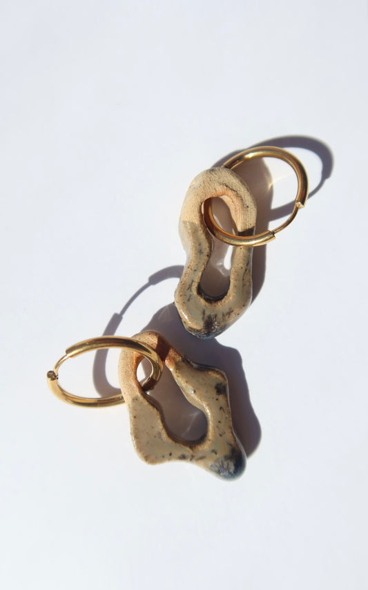 Mosca handmade ceramic earrings in Beige — organic sculpted clay with glossy glaze, made in Lisbon Portugal by Jadeo Studio
