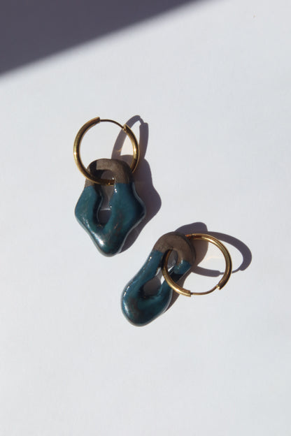 Mosca handmade ceramic earrings in Blue Green on Dark Clay — organic sculpted clay with glossy glaze, made in Lisbon Portugal by Jadeo Studio, silver and gold hoop