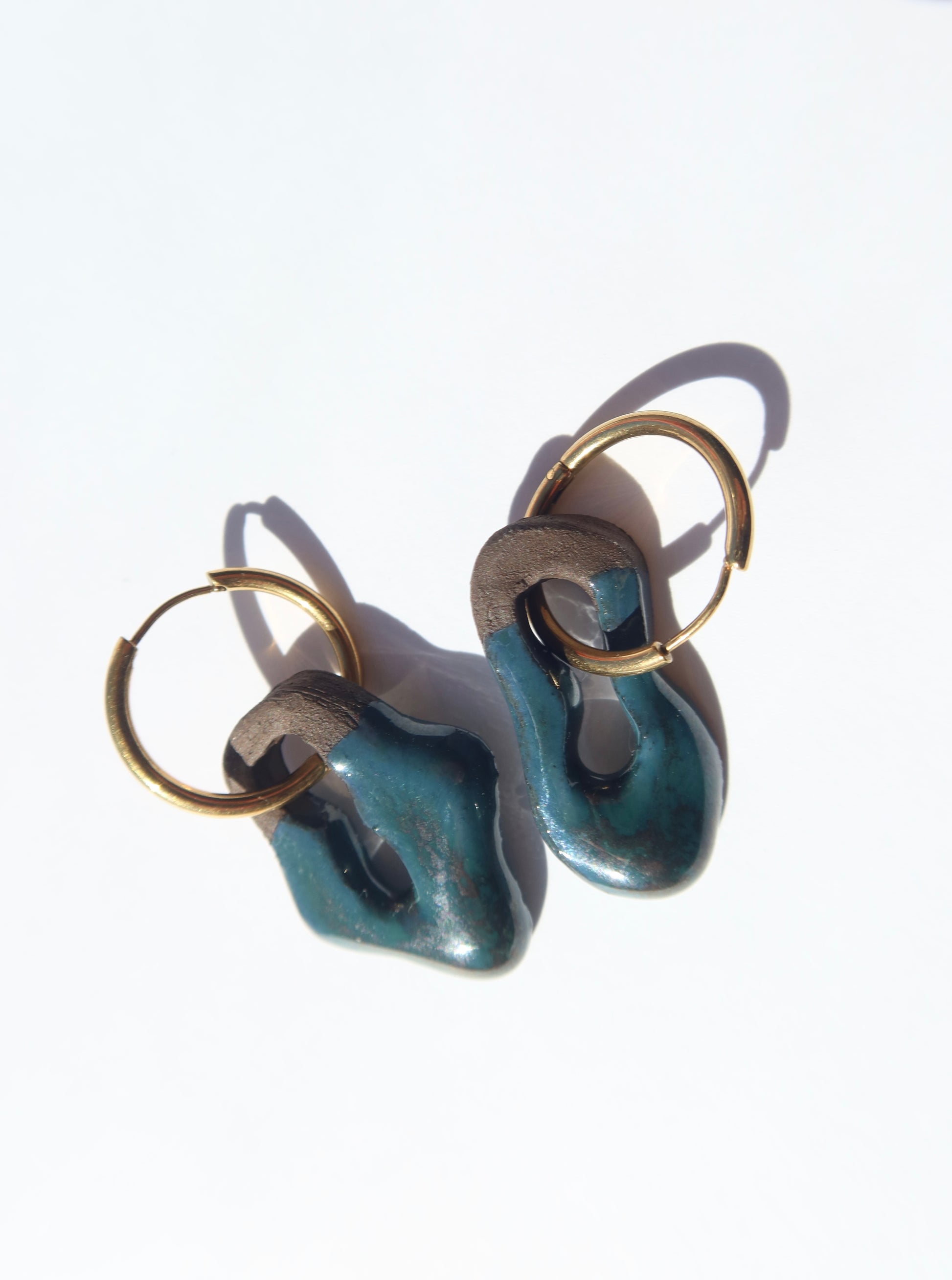 Mosca handmade ceramic earrings in Blue Green on Dark Clay — organic sculpted clay with glossy glaze, made in Lisbon Portugal by Jadeo Studio