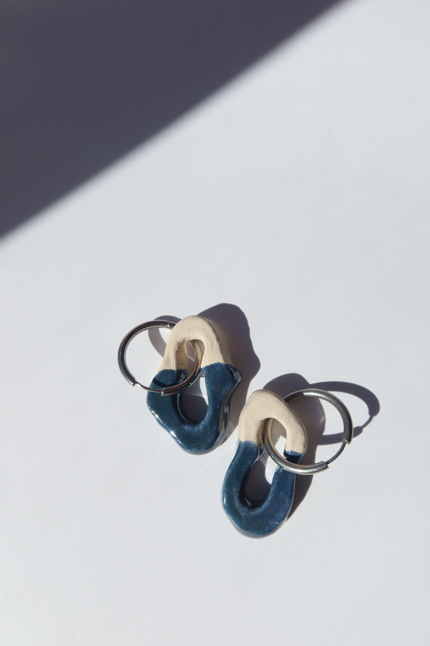 Mosca handmade ceramic earrings in Blue Green — organic sculpted clay with glossy glaze, made in Lisbon Portugal by Jadeo Studio, Lisbon lifestyl