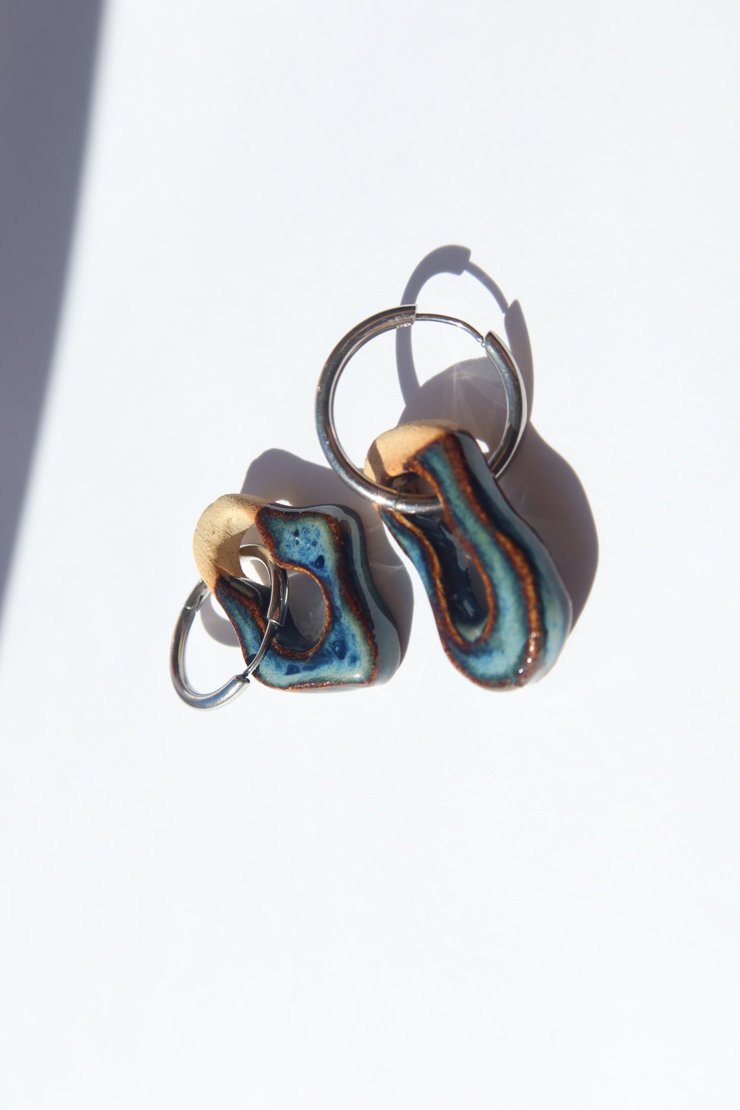 Mosca handmade ceramic earrings in Blue Jeans — organic sculpted clay with glossy glaze, made in Lisbon Portugal by Jadeo Studio, ilver and gold hoop
