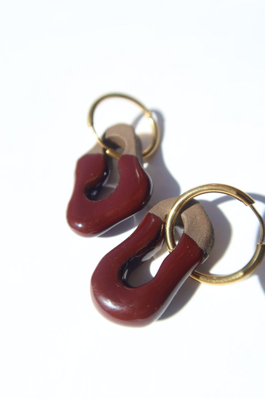 Mosca handmade ceramic earrings in Brown Red on Dark Clay — organic sculpted clay with glossy glaze, made in Lisbon Portugal by Jadeo Studio
