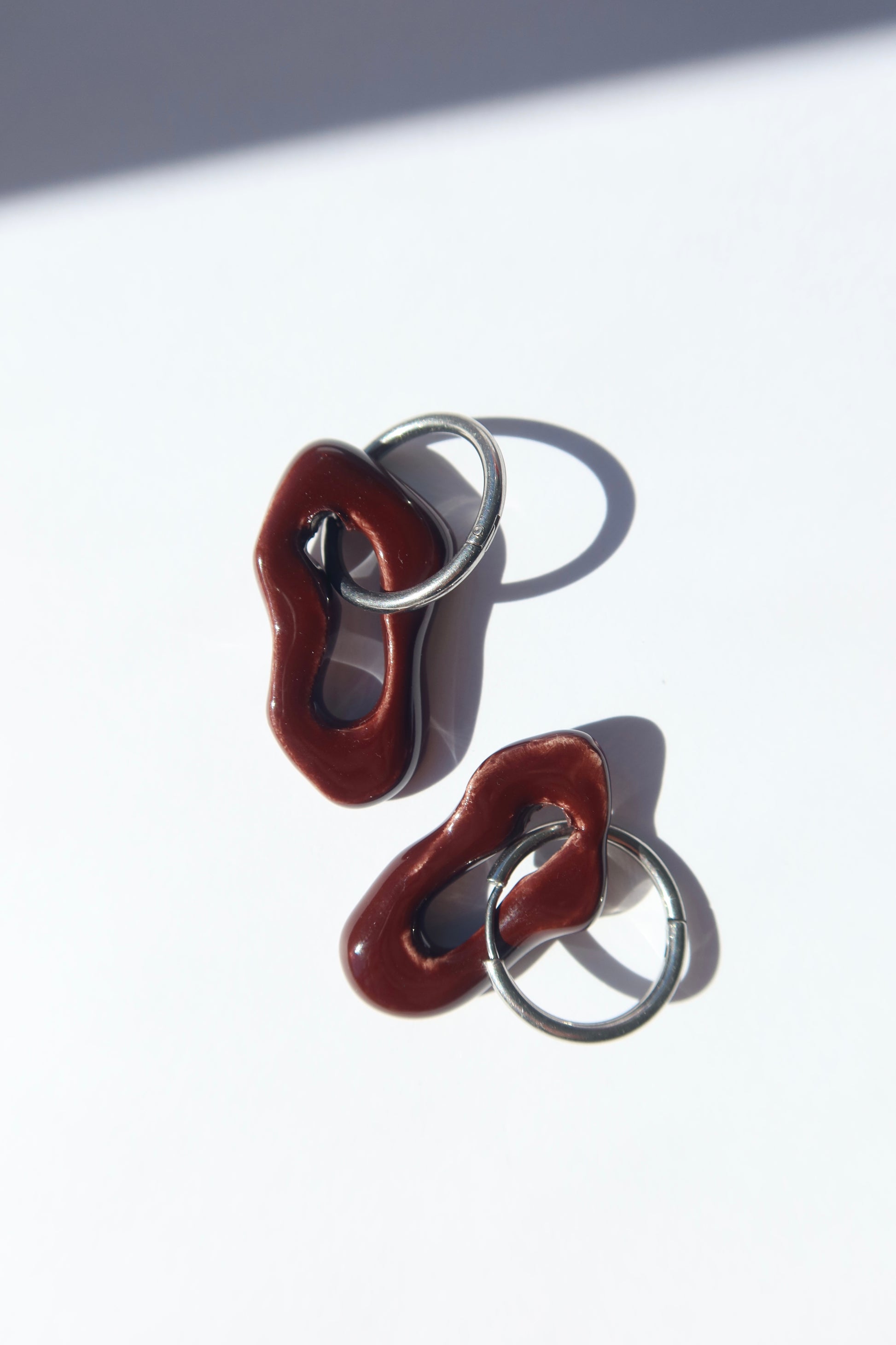 Mosca handmade ceramic earrings in Brown Red — organic sculpted clay with glossy glaze, made in Lisbon Portugal by Jadeo Studio, handmade ceramic jewelry