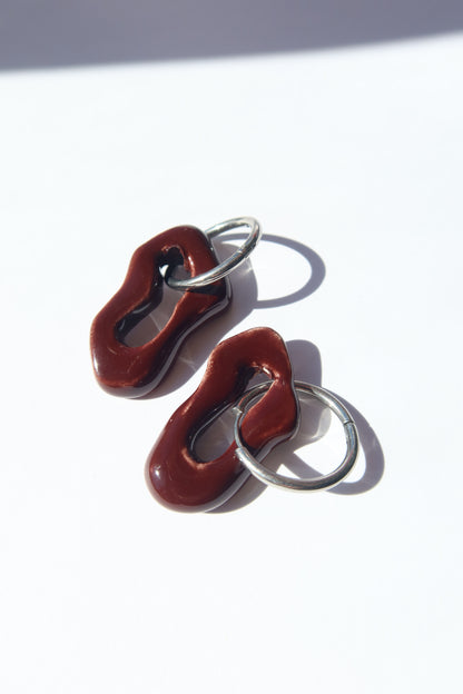 Mosca handmade ceramic earrings in Brown Red — organic sculpted clay with glossy glaze, made in Lisbon Portugal by Jadeo Studio