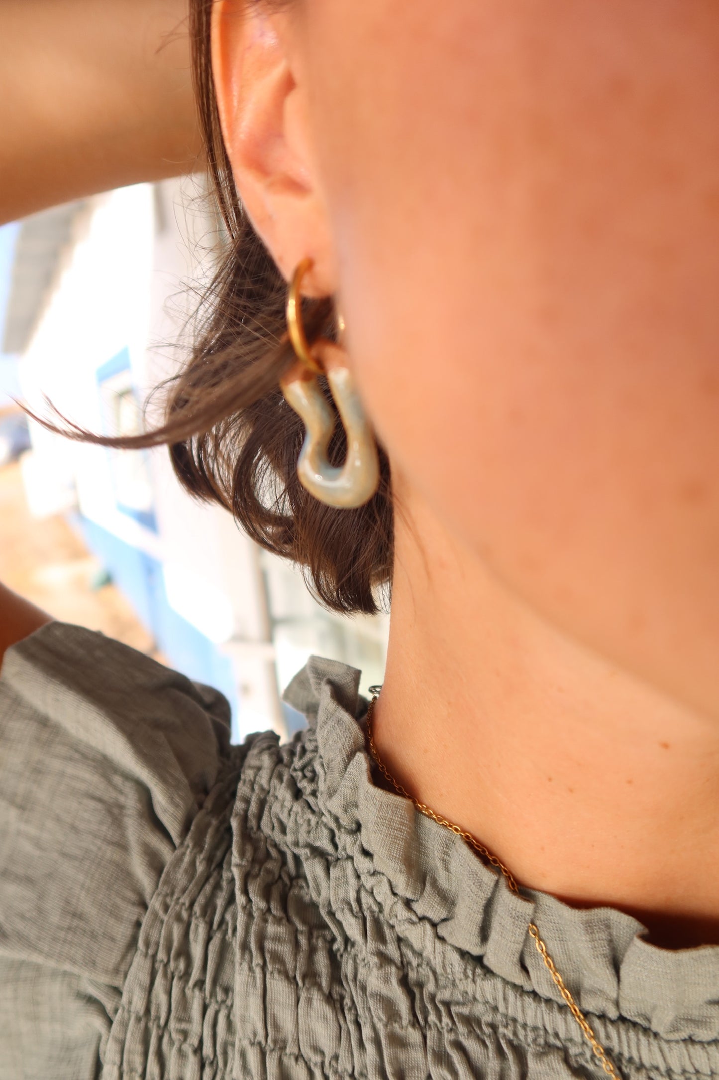 Mosca handmade ceramic earrings in Crackled Light Blue — organic sculpted clay with glossy crackled glaze, made in Lisbon Portugal by Jadeo Studio, Lisbon lifestyle