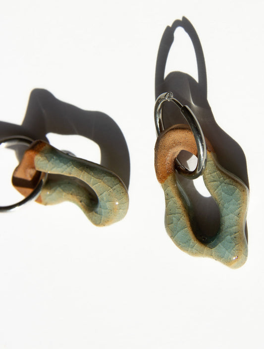Mosca handmade ceramic earrings in Crackled Light Blue — organic sculpted clay with glossy crackled glaze, made in Lisbon Portugal by Jadeo Studio