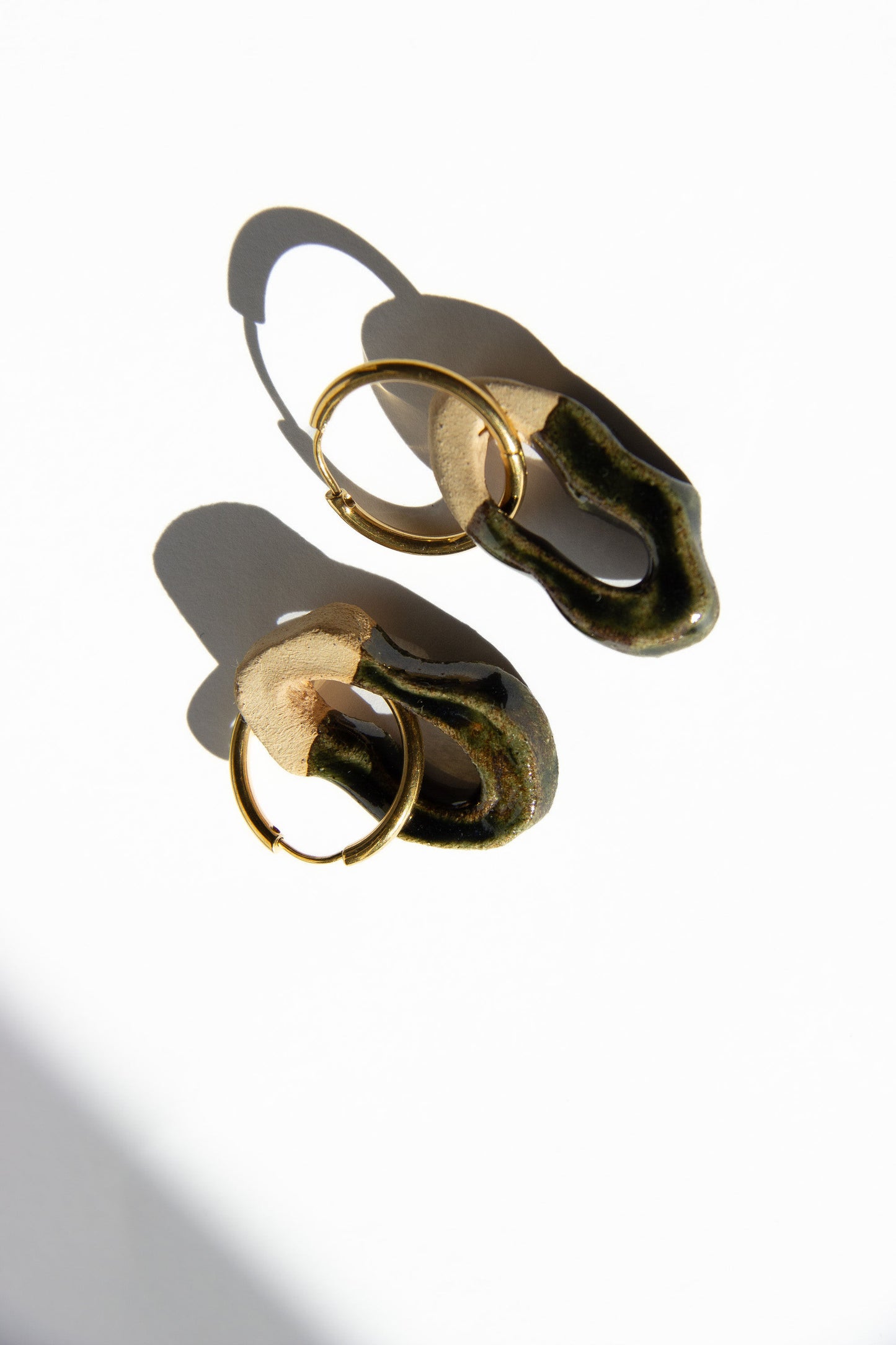Mosca handmade ceramic earrings in Dark Green — organic sculpted clay with glossy glaze, made in Lisbon Portugal by Jadeo Studio, earth-fired