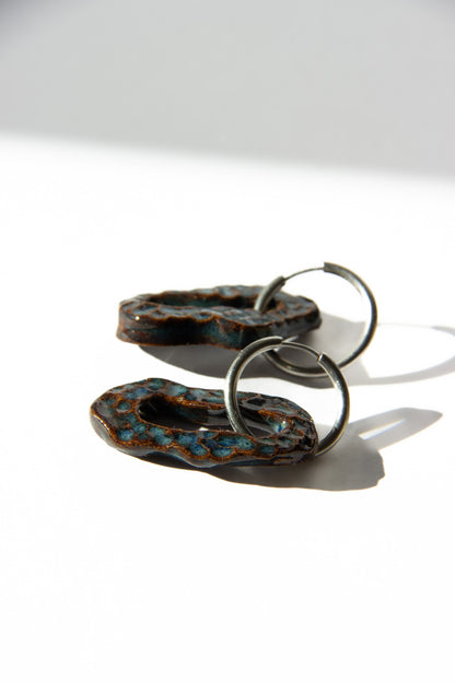 Mosca handmade ceramic earrings in Dotted Blue Jeans — organic sculpted clay with glossy glaze and dotted texture, statement jewlery made in Lisbon Portugal by Jadeo Studio