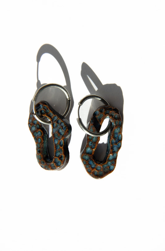 Mosca handmade ceramic earrings in Dotted Blue Jeans — organic sculpted clay with glossy glaze and dotted texture, made in Lisbon Portugal by Jadeo Studio