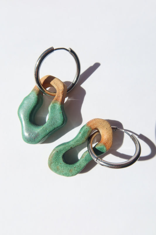 Mosca handmade ceramic earrings in Green Mat — organic sculpted clay with glossy glaze, pair shown in natural light, made in Lisbon Portugal by Jadeo Studio