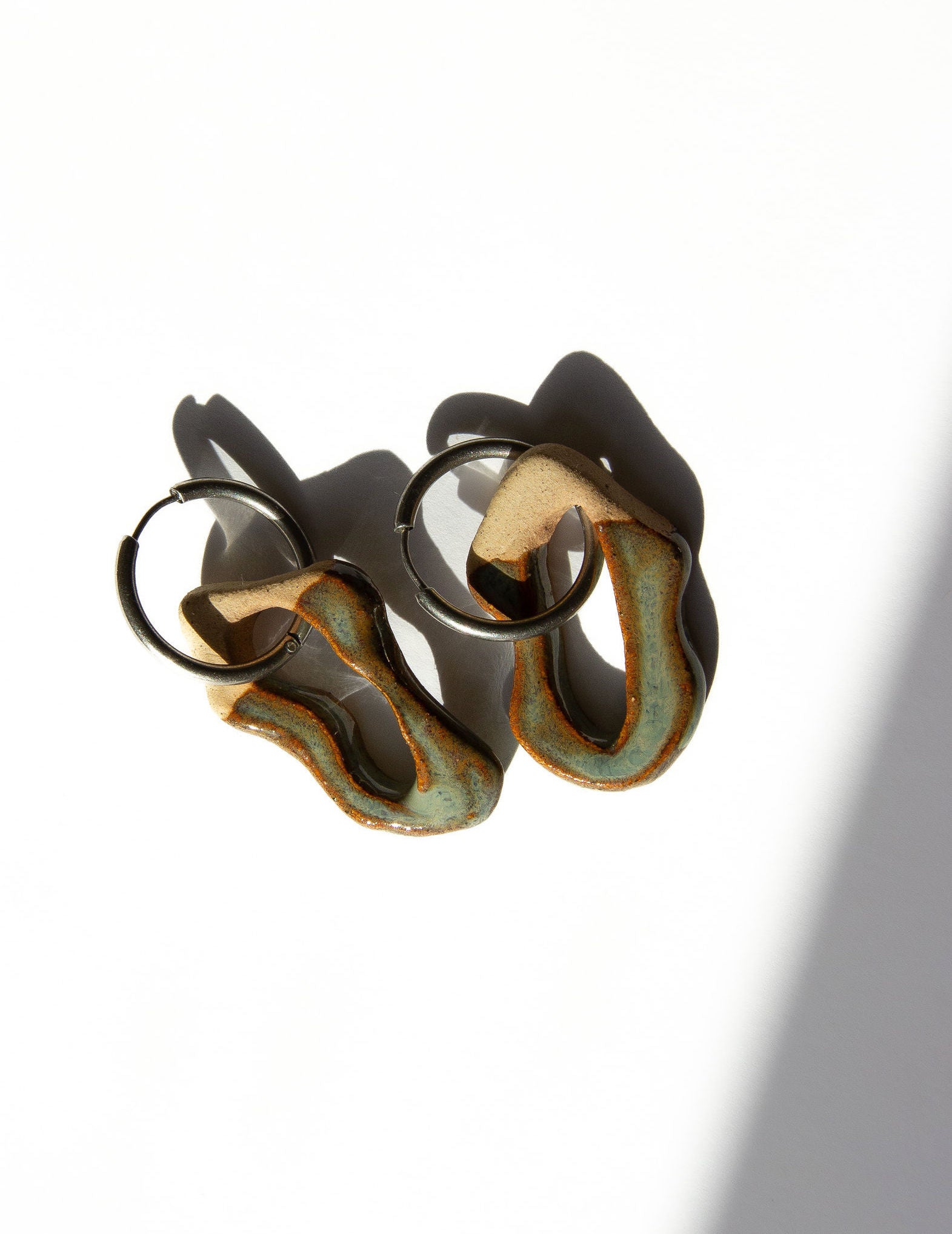 Mosca handmade ceramic earrings in Grey Green — organic sculpted clay with glossy glaze, made in Lisbon Portugal by Jadeo Studio