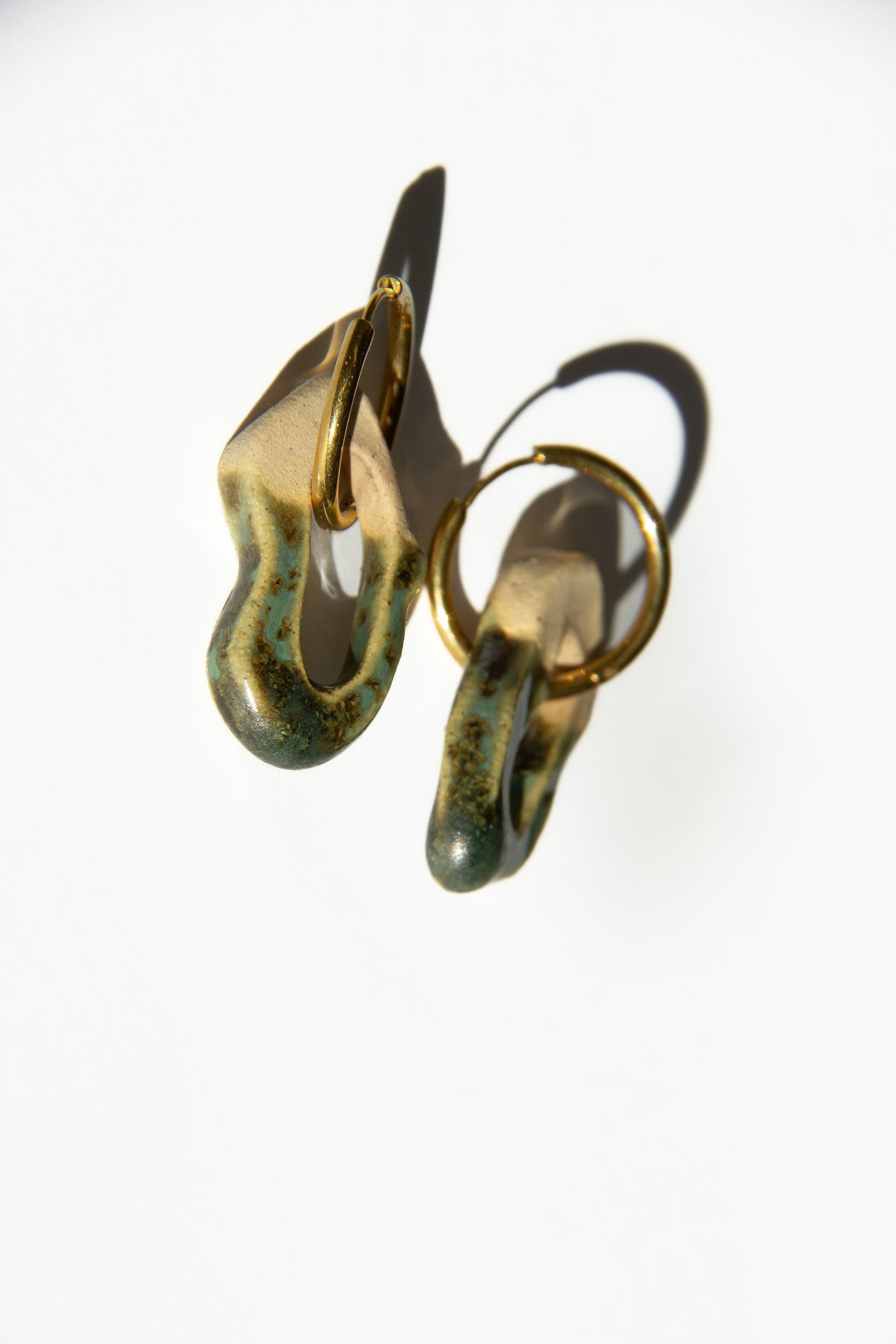 Mosca handmade ceramic earrings in Light Green — organic sculpted clay with glossy glaze, statement jewelry made in Lisbon Portugal by Jadeo Studio