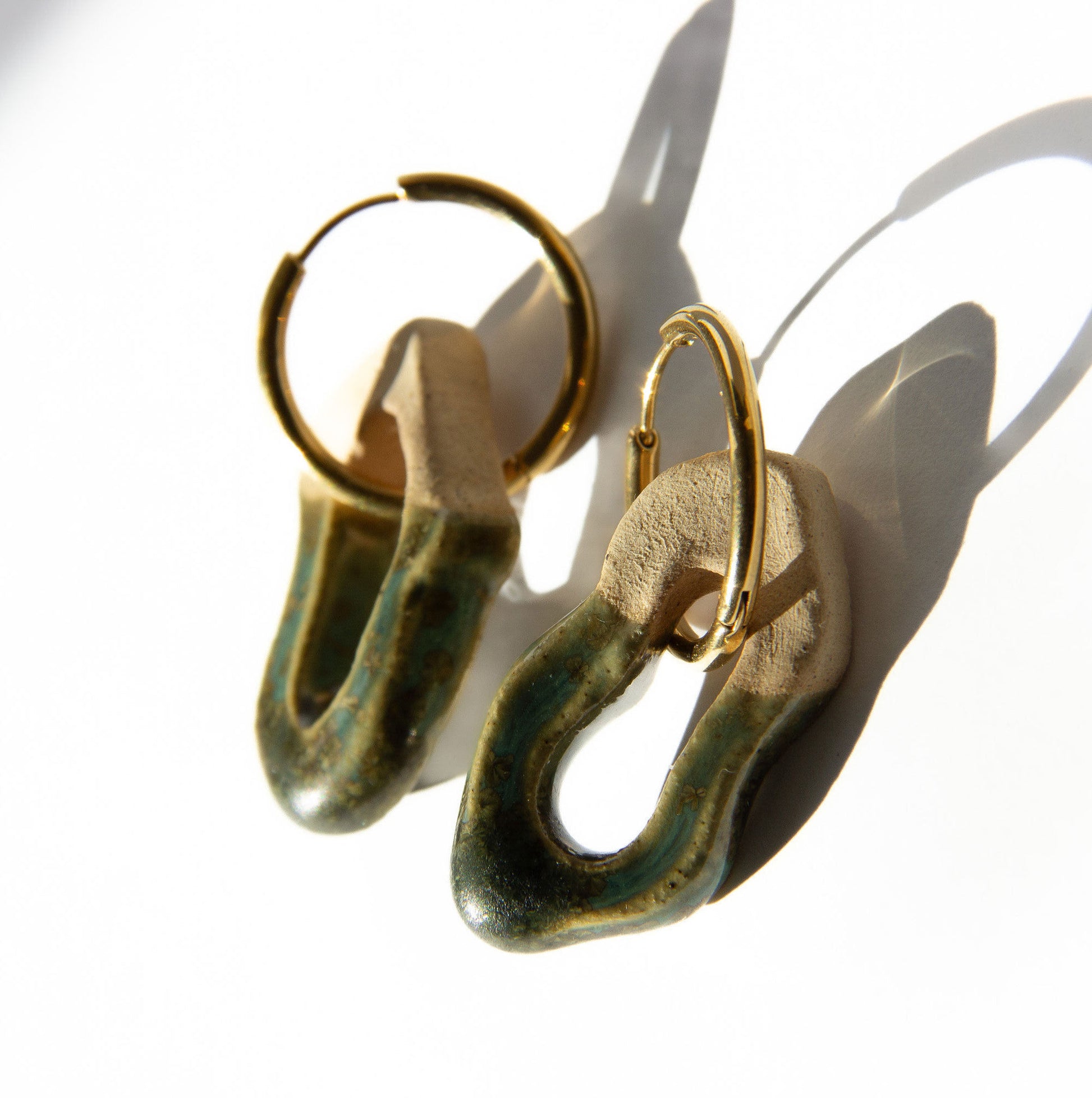 Mosca handmade ceramic earrings in Light Green — organic sculpted clay with glossy glaze, made in Lisbon Portugal by Jadeo Studio, silver and gold hoop