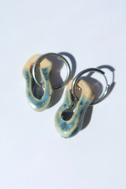 Mosca handmade ceramic earrings in Sparkling Blue — organic sculpted clay with glossy glaze, pair shown in natural light, made in Lisbon Portugal by Jadeo Studio