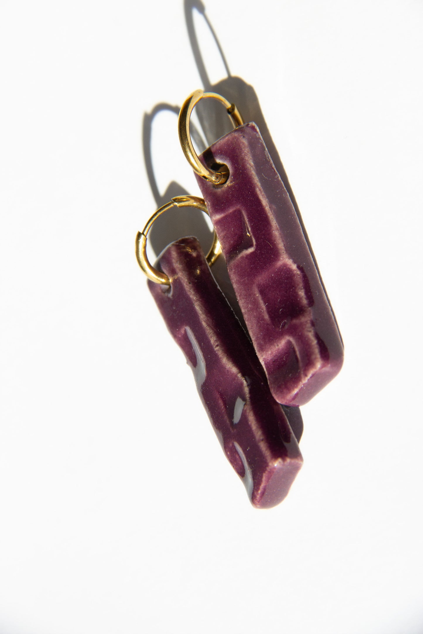 Penha handmade ceramic earrings in Aubergine — minimalist rectangular drop, sculpted clay, made in Lisbon Portugal by Jadeo Studio, unique jewelry