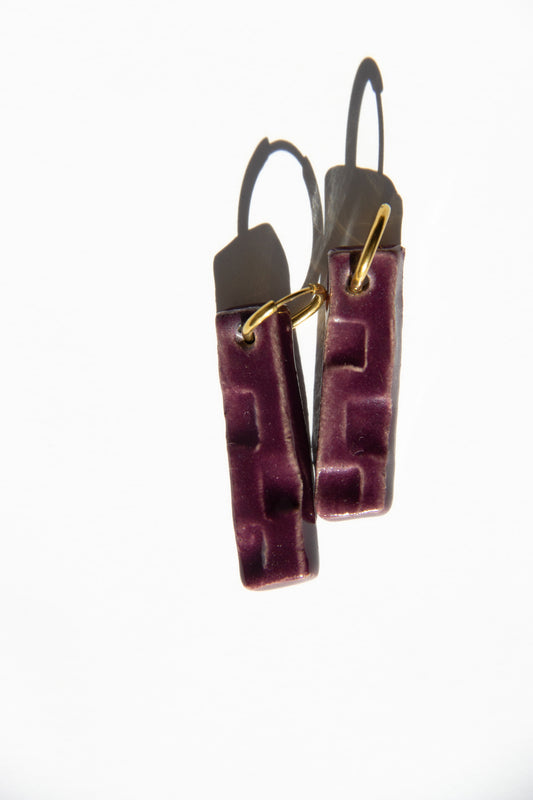 Penha handmade ceramic earrings in Aubergine — minimalist rectangular drop, sculpted clay, made in Lisbon Portugal by Jadeo Studio