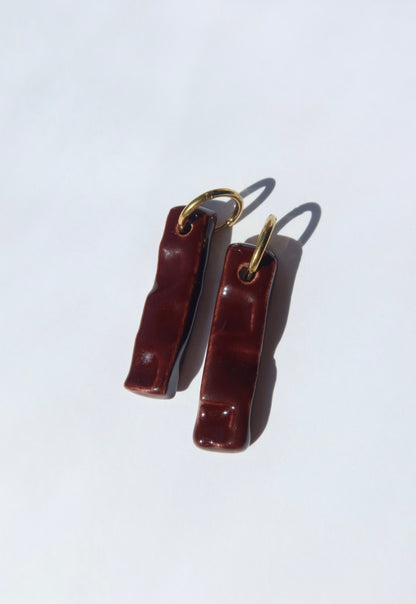 Penha handmade ceramic earrings in Brown Red — minimalist rectangular drop, sculpted clay, made in Lisbon Portugal by Jadeo Studio, silver and gold hoop