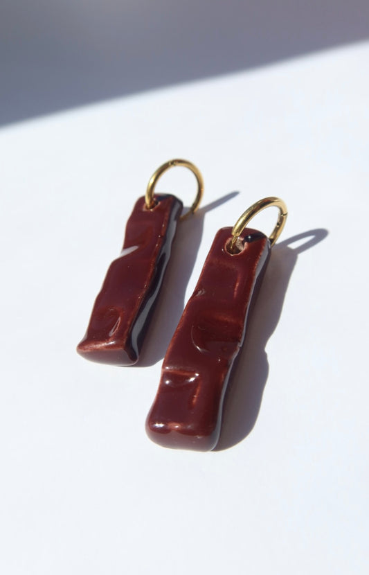 Penha handmade ceramic earrings in Brown Red — minimalist rectangular drop, sculpted clay, made in Lisbon Portugal by Jadeo Studio