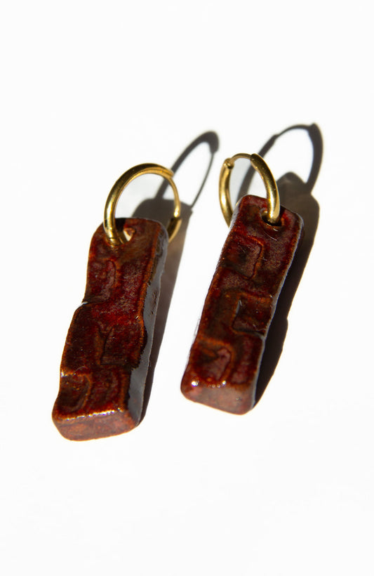 Penha handmade ceramic earrings in Burgundy — minimalist rectangular drop, sculpted clay, made in Lisbon Portugal by Jadeo Studio