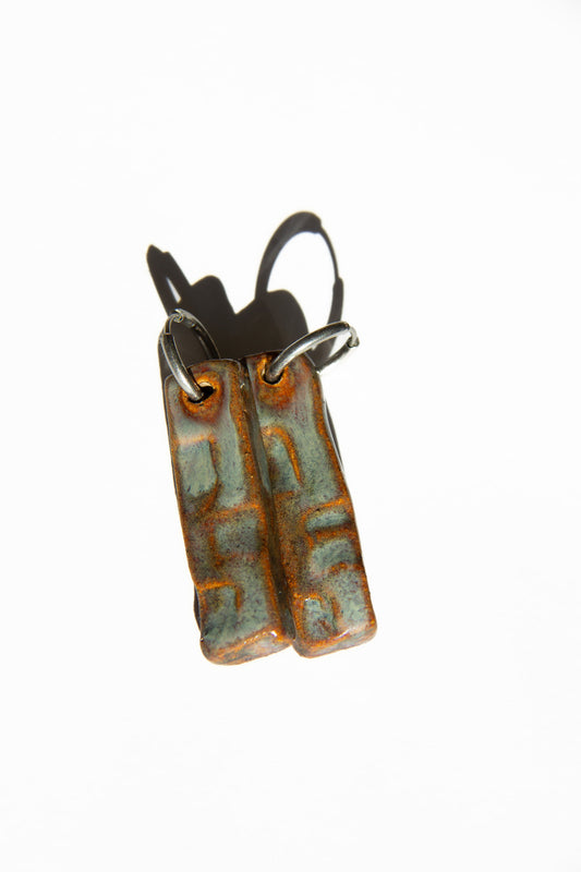 Penha handmade ceramic earrings in Grey Green — minimalist rectangular drop, sculpted clay, made in Lisbon Portugal by Jadeo Studio