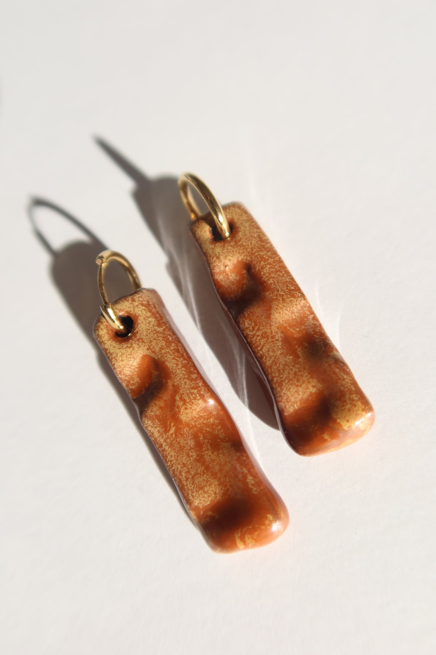Penha handmade ceramic earrings in Sparkling Brown — minimalist rectangular drop, sculpted clay, made in Lisbon Portugal by Jadeo Studio